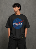 Model wearing black Pizza Glitch oversized t-shirt with bold pizza graphic front print by Snitch Glitch