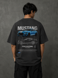 Model wearing dark Mustang Shelby oversized t-shirt with cobra-style front graphic by Snitch Glitch