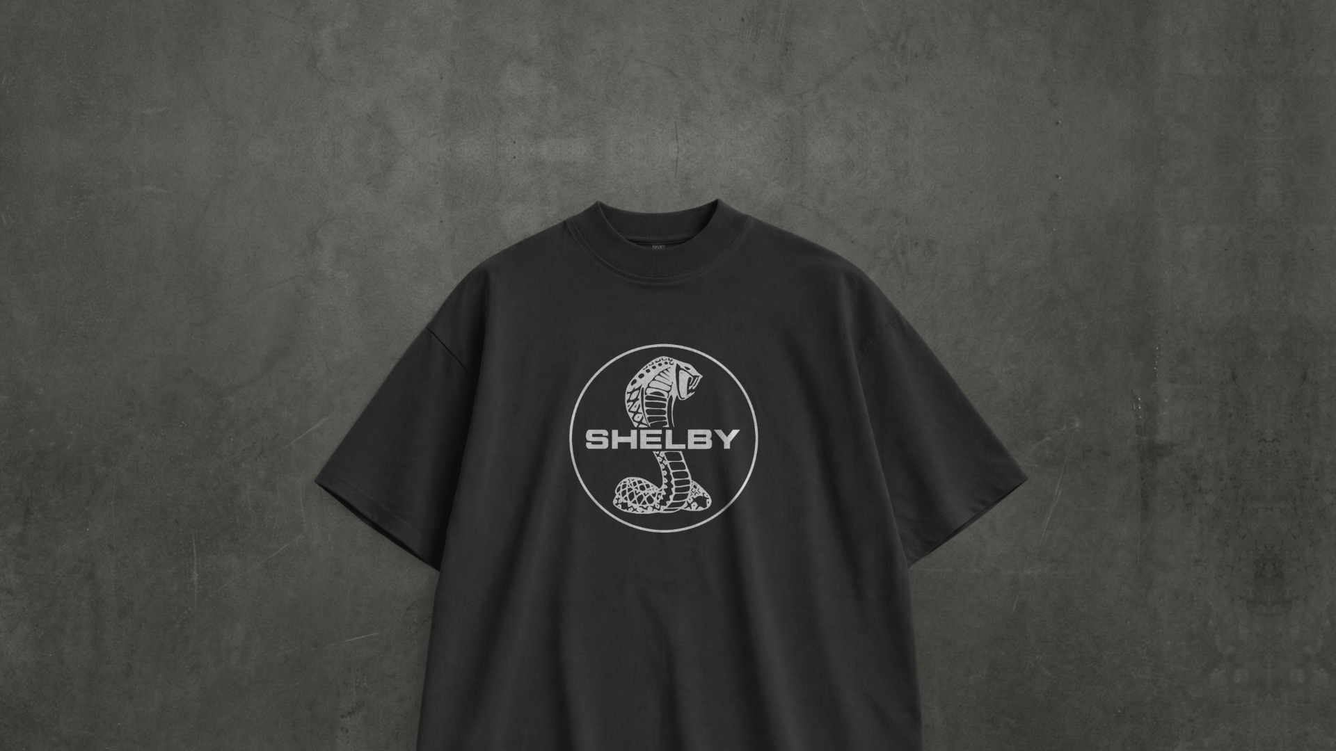 Dark oversized t-shirt with Shelby cobra-style front graphic print by Snitch Glitch